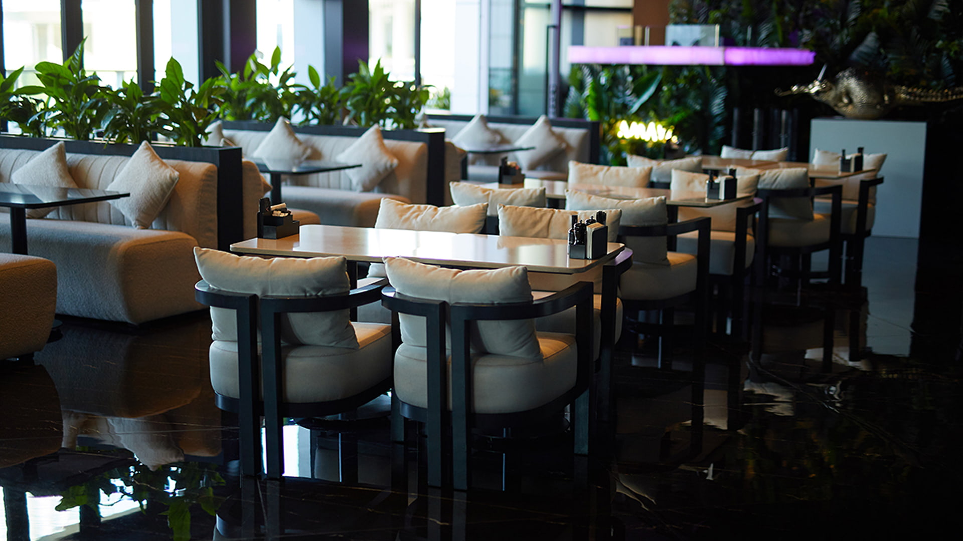 Elegant indoor dining space at MYA Dubai Mall featuring modern seating, soft lighting, and a stylish, comfortable ambiance.