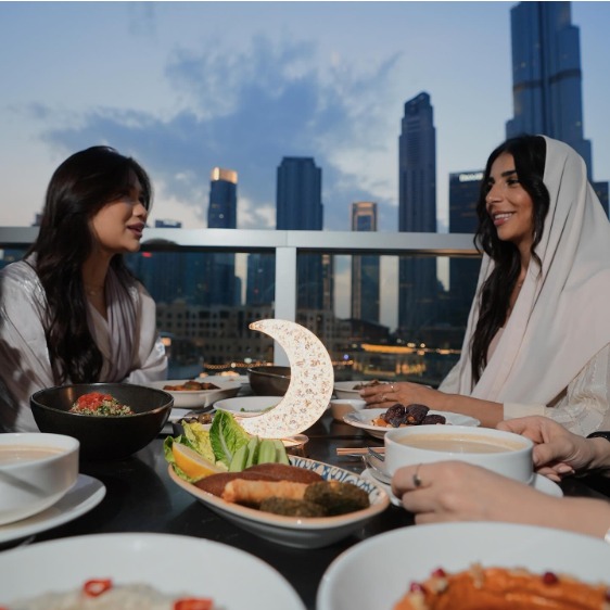 two ladies enjoying meal at a riverside restaurant